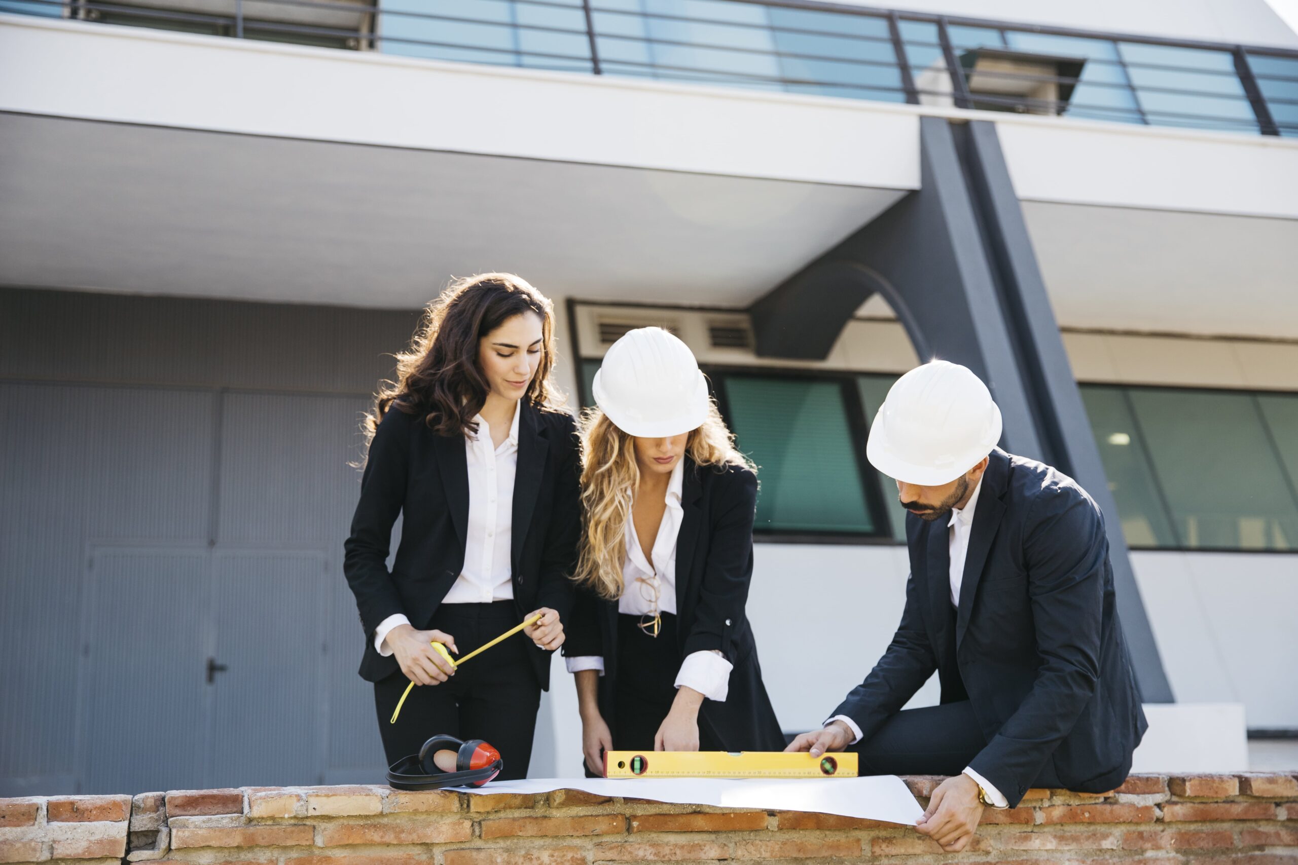 three-architects-wearing-helmets-min